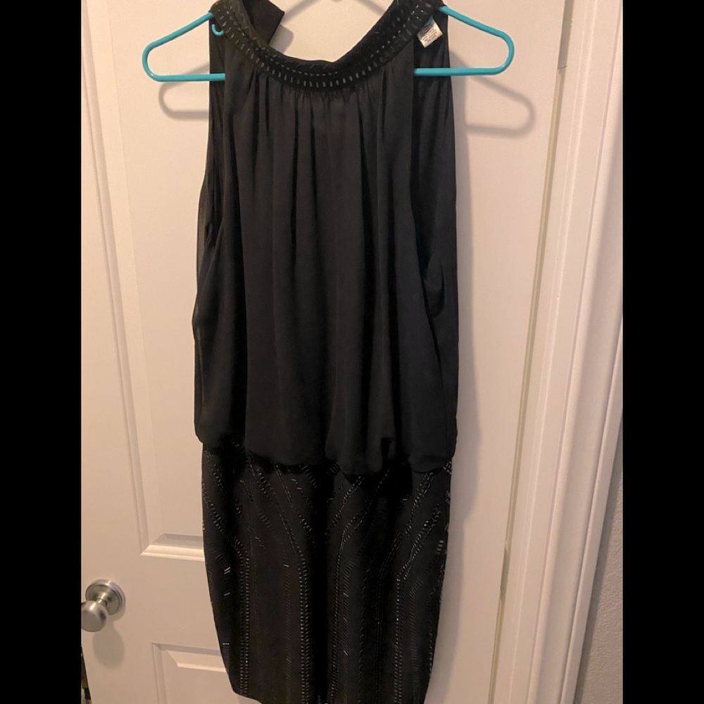 Cache size 12 black w/silver beading on lower part. Sleeveless mid length